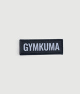 GYMKUMA logo patch in black with white raised stitching