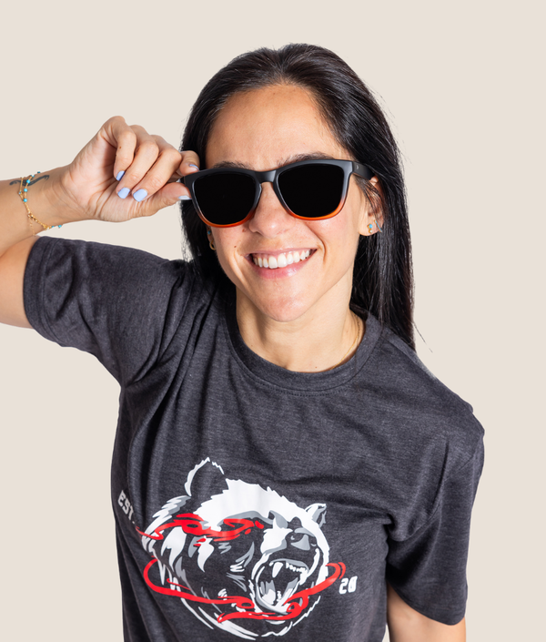 Black and orange polarized wraparound sunglasses by GYMKUMA