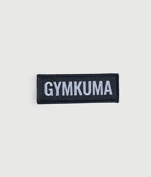 GYMKUMA logo patch in black with white raised stitching